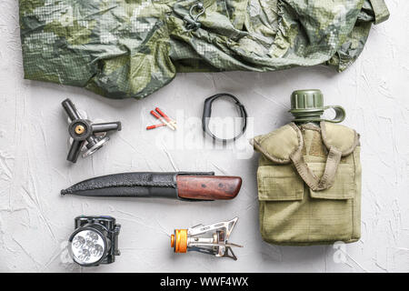 Set of items for camping on grey background Stock Photo