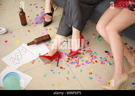 Drunk women in messy room after party Stock Photo