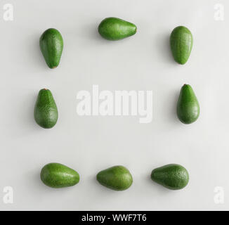 Frame made of ripe avocados on white background Stock Photo