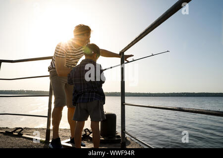 Father son silhouette fishing Stock Photos - Page 1 : Masterfile