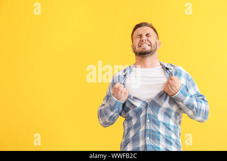 Man having panic attack on color background Stock Photo