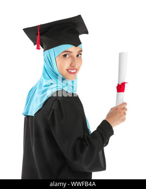 Muslim female graduate with diploma on white background Stock Photo