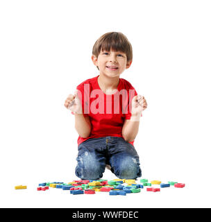 Cute little boy with letters on white background Stock Photo