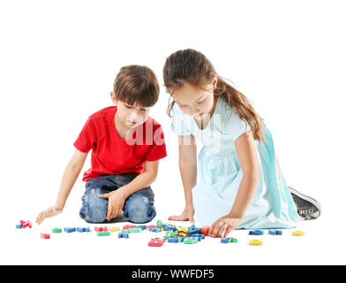 Cute little children with letters on white background Stock Photo