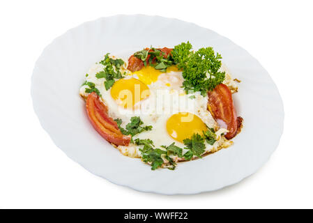 Fried eggs and vegetables in plate isolated on with with clipping path Stock Photo
