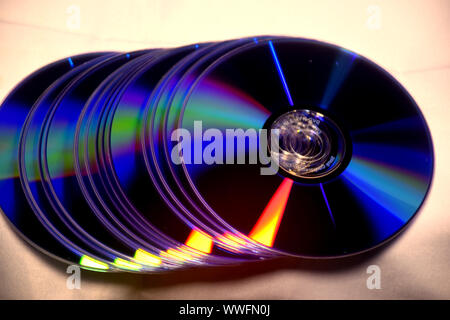 Vintage CD or DVD disk background, old circle discs used for data storage, share movies and music Stock Photo