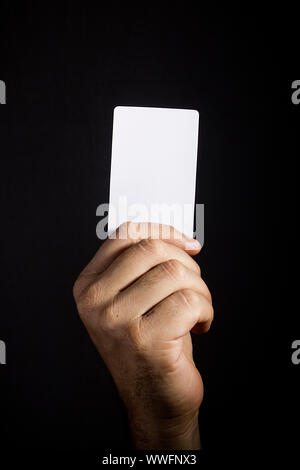 Male hand with a white cardboard card Stock Photo