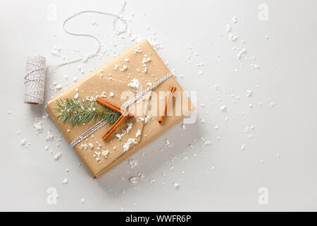 Beautiful Christmas gift box with threads on white background Stock Photo