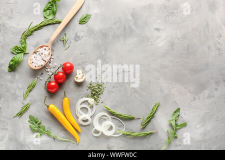 Fresh herbs with vegetables and spices on grunge background Stock Photo