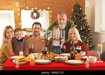 Happy family celebrating Christmas at home Stock Photo