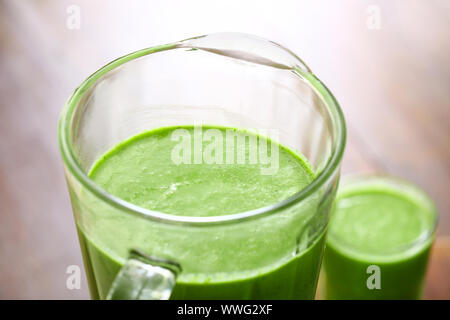 Blender with healthy smoothie on table, closeup Stock Photo