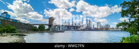 New York, USA - June 3rd 2019: Brooklyn Bridge, Jane's Carousel and Cityscape of New York. Panoramic view Stock Photo
