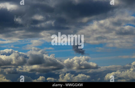 Storm clouds against a blue sky Stock Photo