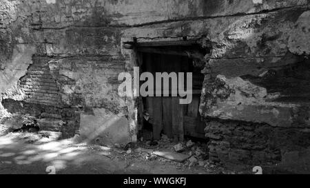 Wood Cover Hole In Abandon Tobacco Factory So People Cannot Trespass In Black and White Stock Photo