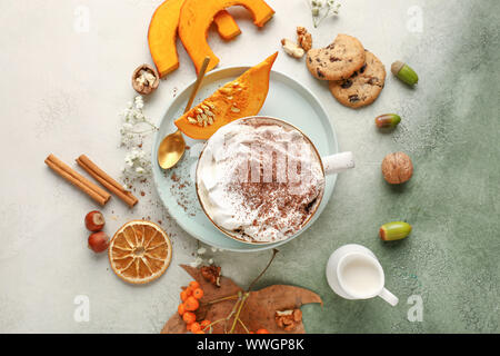Composition with cup of tasty pumpkin coffee on light background Stock Photo