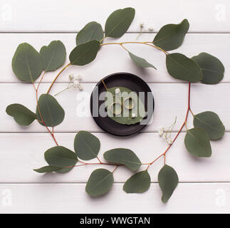 Top view of wedding ring composition on white wooden table Stock Photo