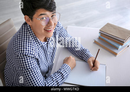 Asian student preparing for exam at home Stock Photo