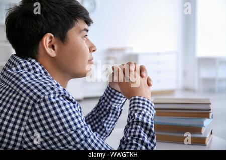 Asian student preparing for exam at home Stock Photo