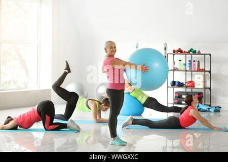 Body positive women training in gym Stock Photo