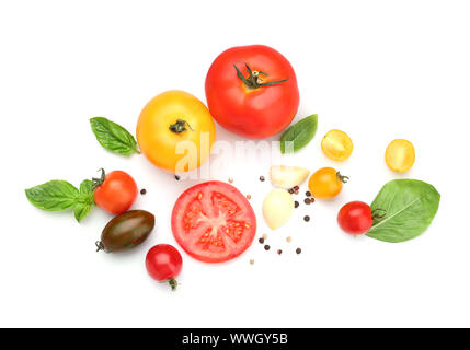 Fresh tomatoes and spices on white background Stock Photo