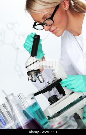 scientist in chemical lab conducting experiments Stock Photo