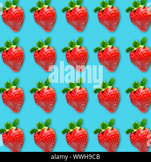 Ripe strawberry pattern on turquoise background, flat lay vibrant color fruit food photo Stock Photo