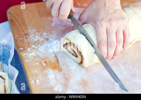 Cutting Cinnamon Roll Dough Stock Photo