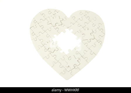 heart made from the puzzle on white Stock Photo