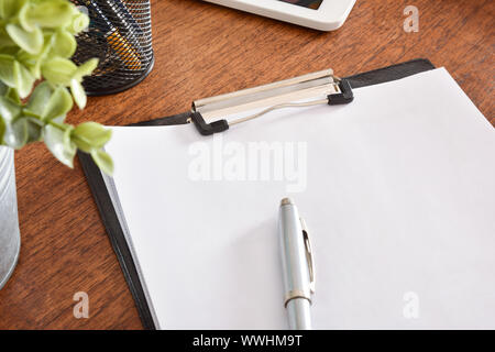 Folder with blank sheets on desk. Horizontal composition. Elevated view. Stock Photo