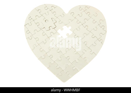 heart made from the puzzle on white Stock Photo