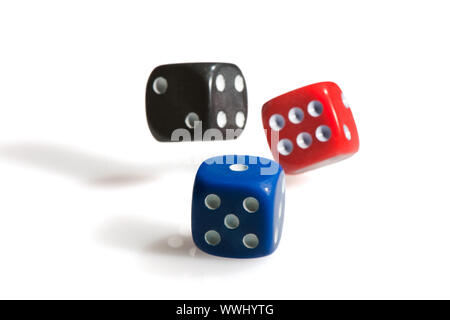 Throwing colorful dices for paying a game Stock Photo