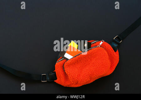 Orange belt bag with credit card. Black Friday sale concept Stock Photo