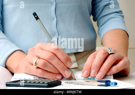 Archritect works on plan papers Stock Photo - Alamy