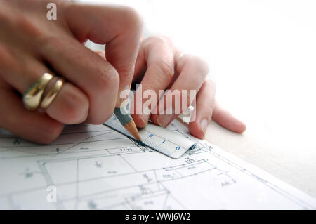 Archritect works on plan papers Stock Photo - Alamy