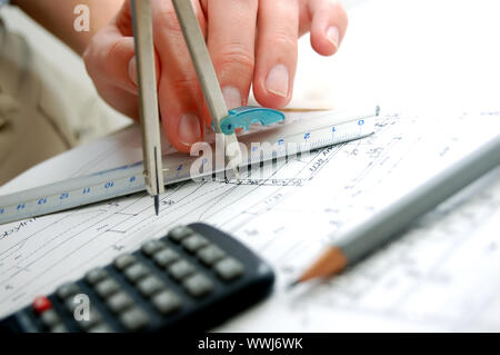 Archritect works on plan papers Stock Photo - Alamy
