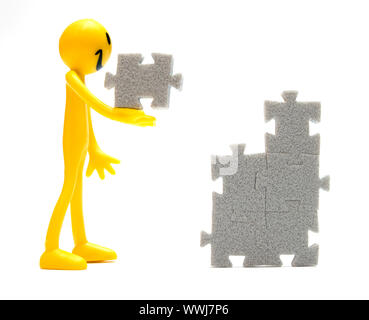 Putting pieces of puzzles together. Conceptual image Stock Photo