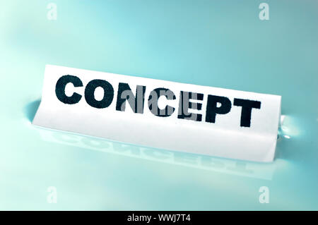 Card floating on water surface with printed word: CONCEPT Stock Photo