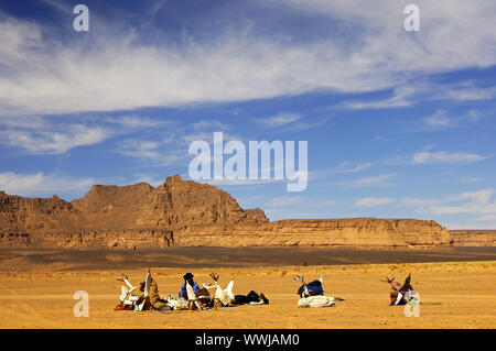 Tuareg at a resting place in the desert Stock Photo