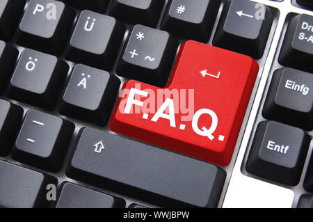 frequently asked questions or faq written on computer key Stock Photo