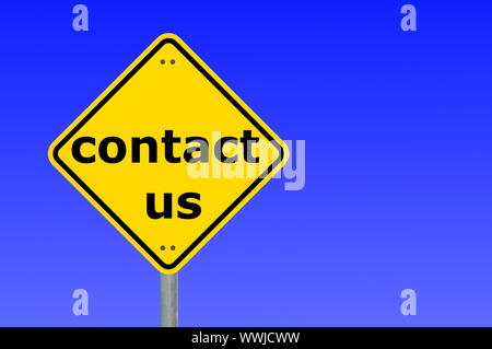 contact us written on a yellow road sign Stock Photo