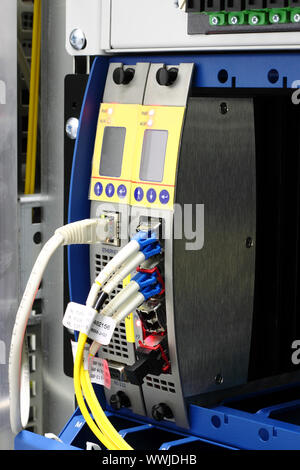 LightGAIN fiber optic wdm multiplexer mounted in rack with lc connector Stock Photo
