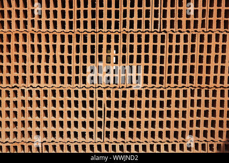 construction bricks stacked red clay brick Stock Photo