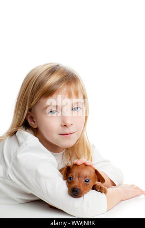 blond kid girl with mini pinscher pet mascot dog on white background ...
