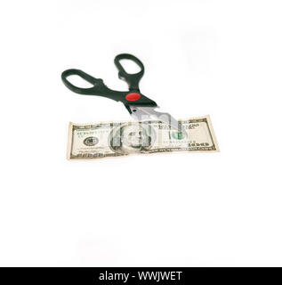 opened stainless scissors cutting us dollar bill closeup  isolated on white Stock Photo