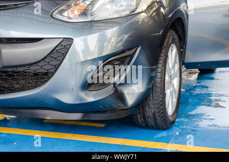 Gray car bump marks on the front bumper. Stock Photo