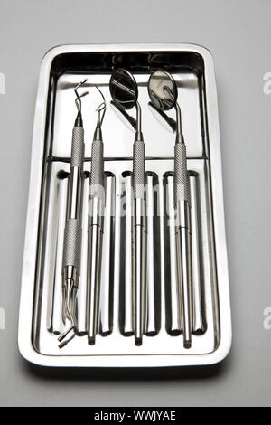 Dental Instruments - angled mirrors, plate, tools Stock Photo - Alamy