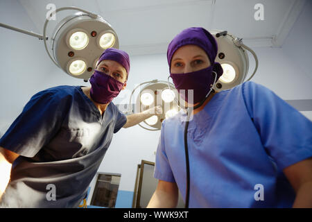 Teamwork with nurse and surgeon performing surgery in hospital operation room Stock Photo