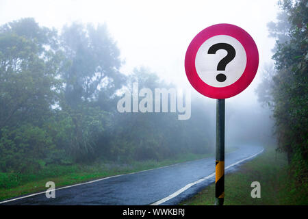 The road to the fog forest and question sign Stock Photo