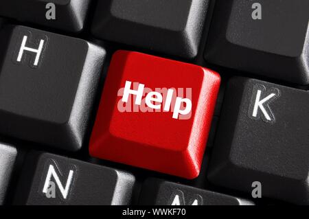 help support or assistance concept with red button on computer keyboard Stock Photo
