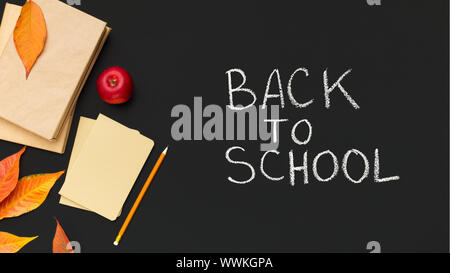 Handwriting text on chalkboard with books and fallen leaves Stock Photo